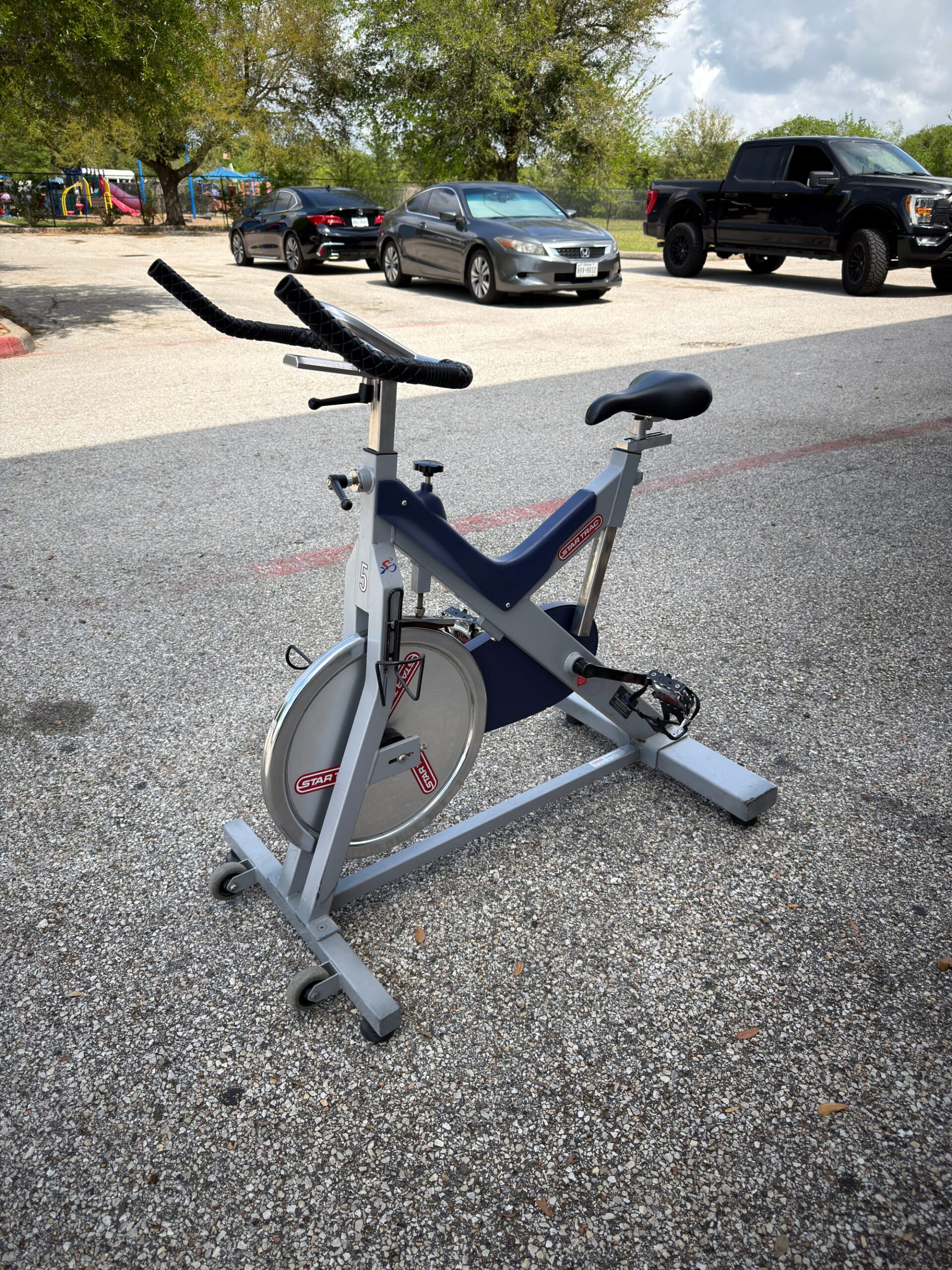 Star Trac V-Bike Commercial Spin Bike — Rides Fine, Seat Adjust Handles Missing